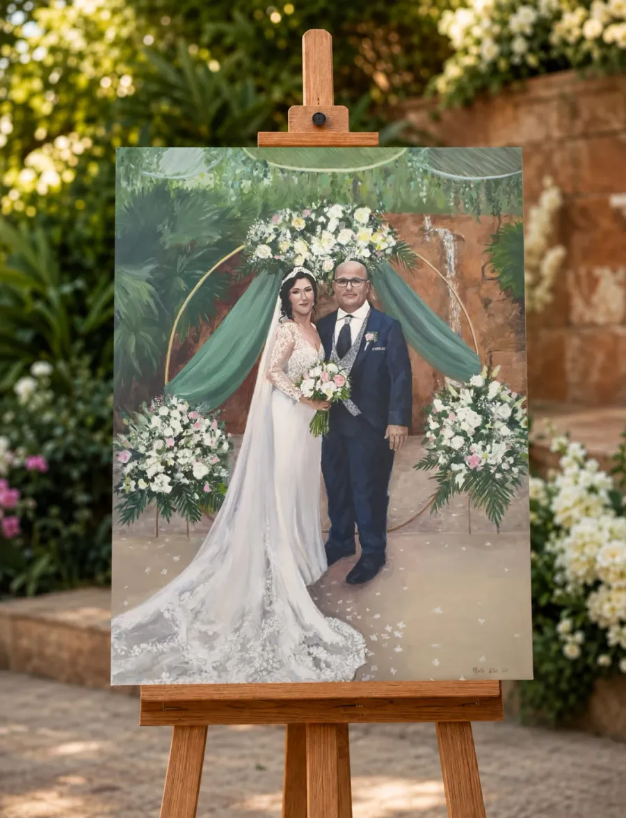 Finished portrait of a bride and groom displayed on a wooden easel in a garden